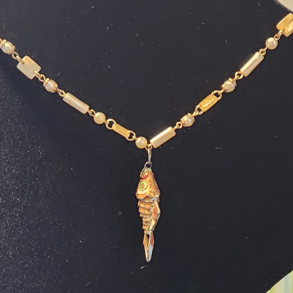 Vintage Chinese gilded orange enamel articulated fish pend with shell necklace.